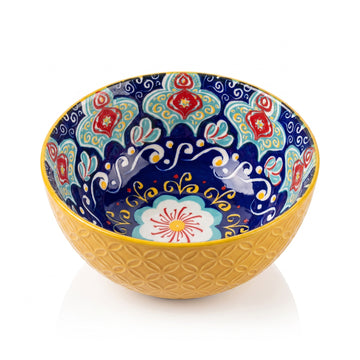 Golden-yellow bowl with cobalt-blue mandala interior, studio photo