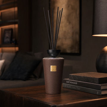 Oud Wood boutique reed diffuser styled on a console table