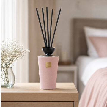 Coco boutique reed diffuser styled in a bedroom